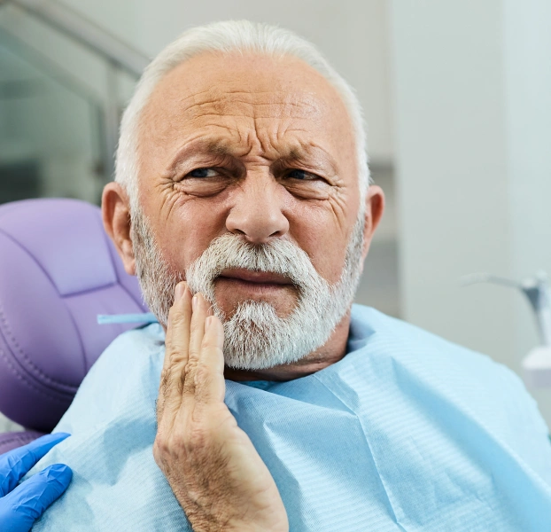 Patient receiving tooth extraction and preservation consultation at Newark Smiles Dental