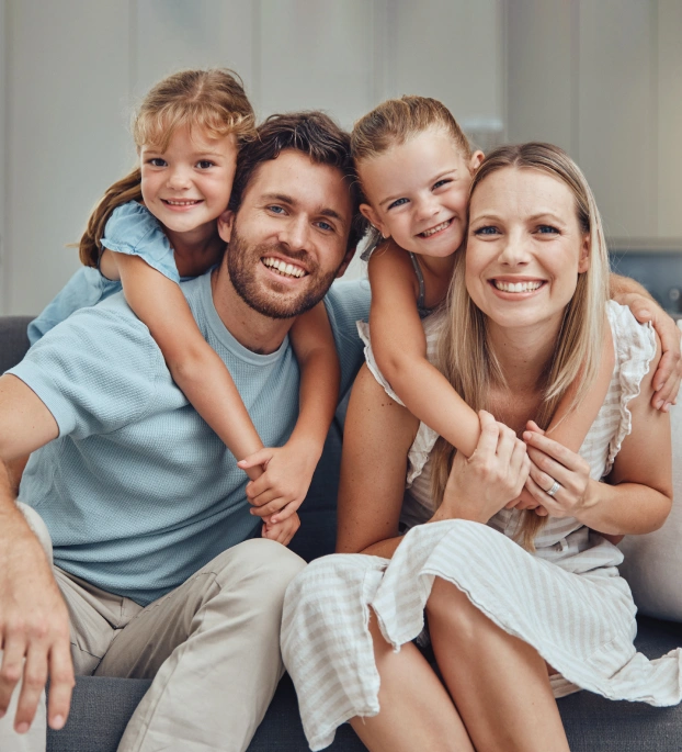 Family smiling together after visiting Newark Smiles Dental