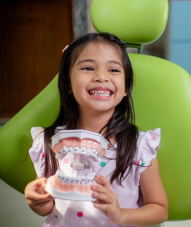 Young patient receiving an orthodontic screening to evaluate tooth alignment.