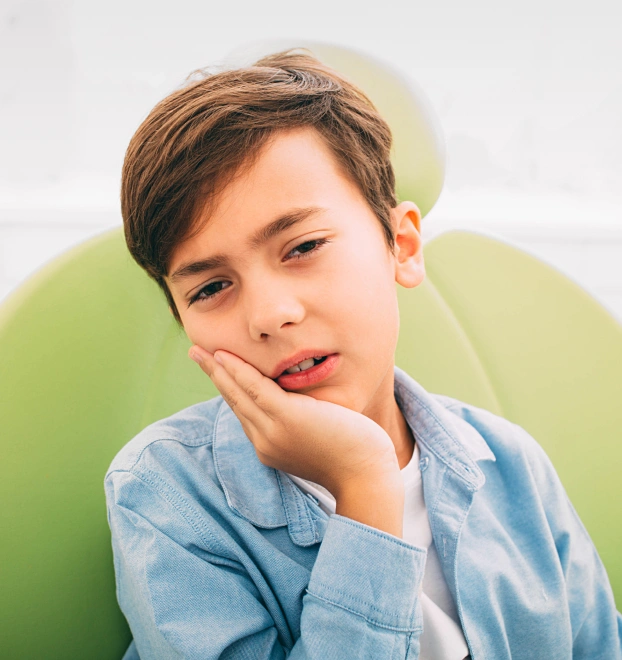 Child visiting the dentist for a tooth extraction consultation