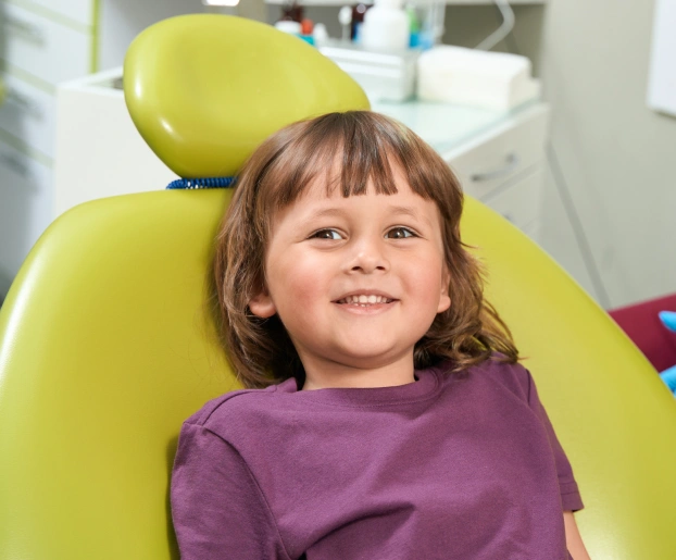 Child receiving treatment for an infected baby tooth