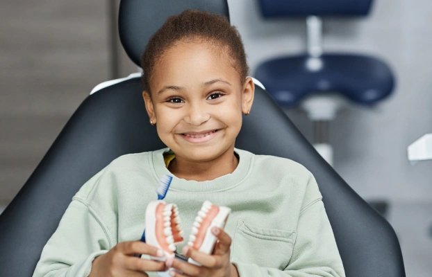 Child receiving silver diamine fluoride treatment for cavities