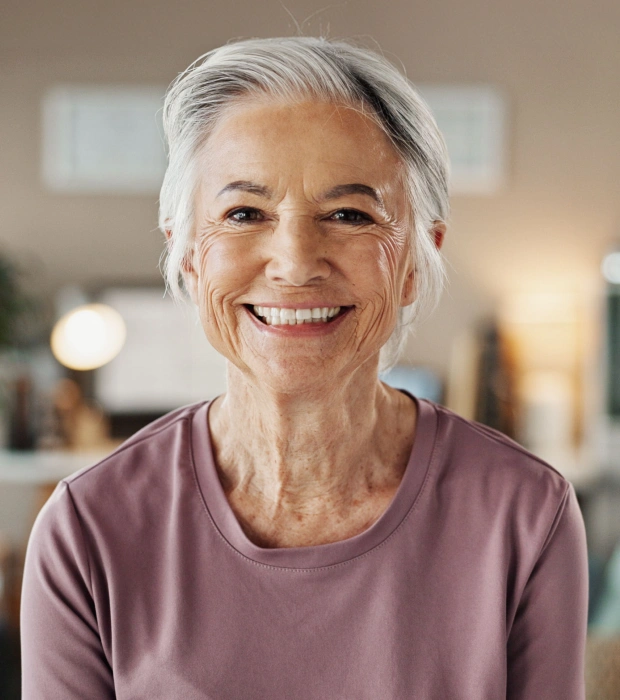 Smiling patient after successful dental implant treatment