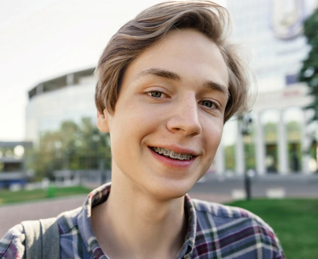 Smiling patient after Six Month Smiles orthodontic treatment